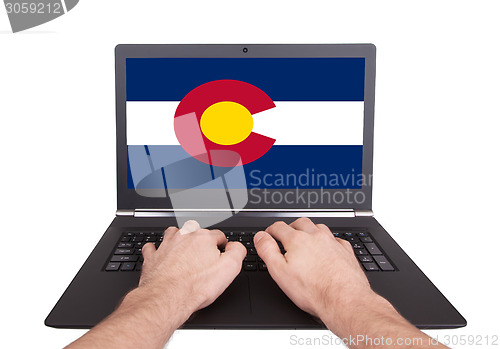 Image of Hands working on laptop, Colorado