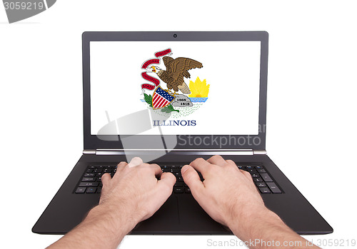 Image of Hands working on laptop, Illinois