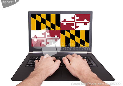 Image of Hands working on laptop, Maryland