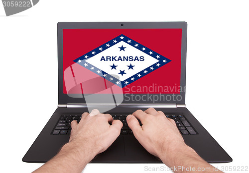 Image of Hands working on laptop, Arkansas