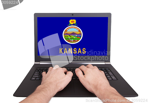 Image of Hands working on laptop, Kansas