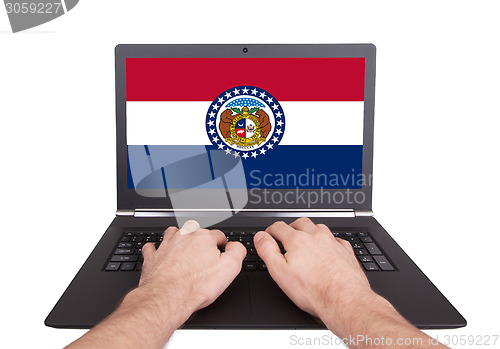 Image of Hands working on laptop, Missouri