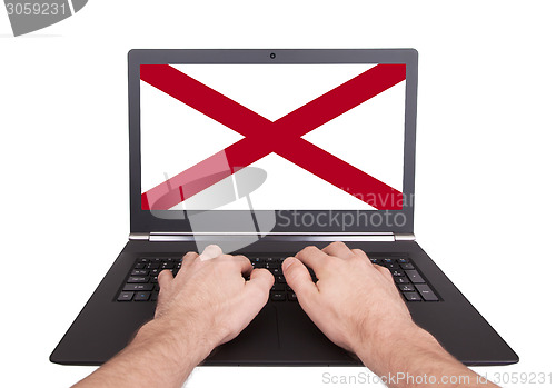 Image of Hands working on laptop, Alabama