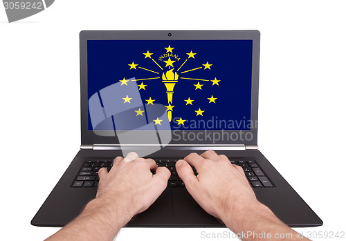 Image of Hands working on laptop, Indiana