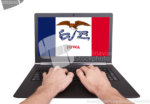Image of Hands working on laptop, Iowa