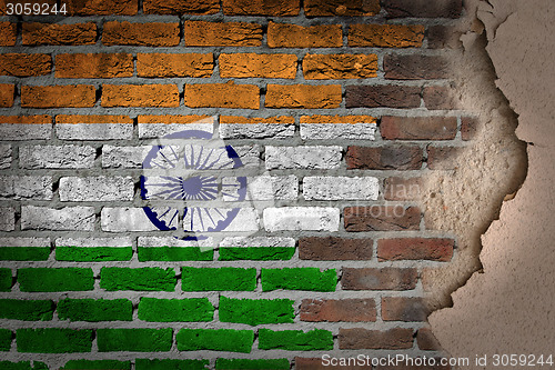 Image of Dark brick wall with plaster - India