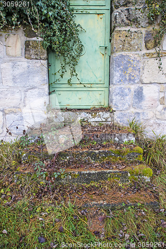 Image of old, medieval abbey wall with door