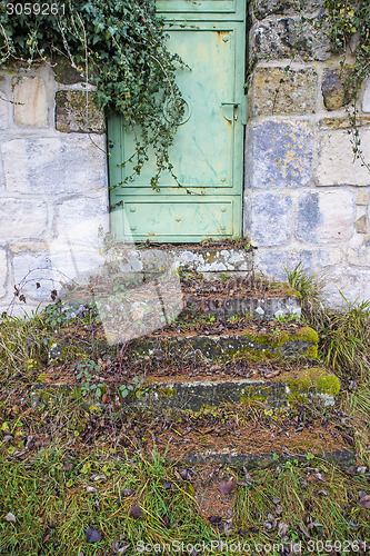 Image of old, medieval abbey wall with door