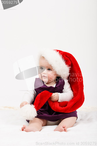 Image of Child girl with Christmas santa hat