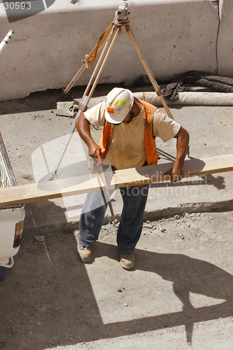 Image of Builder with a hand saw