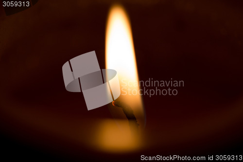 Image of closeup macro of light on candle 