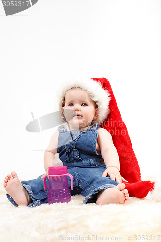 Image of Child girl with Christmas santa hat