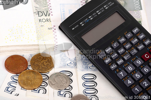 Image of Czech money banknotes, coins and calculator