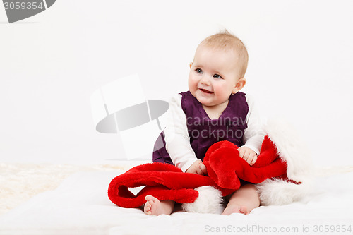 Image of Child girl with Christmas santa hat