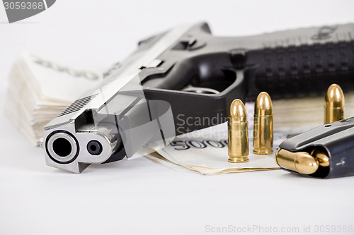 Image of gun with bullet on czech banknotes