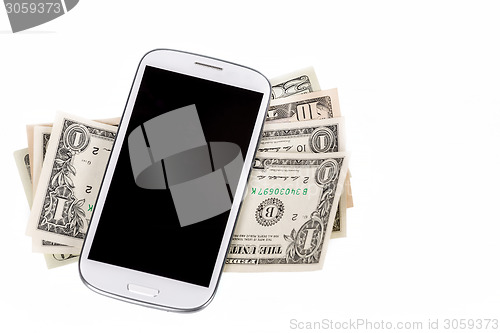 Image of cellphone and money on white