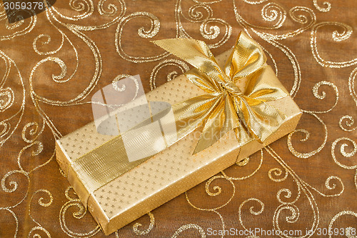 Image of detail luxury gift with golden ribbon 