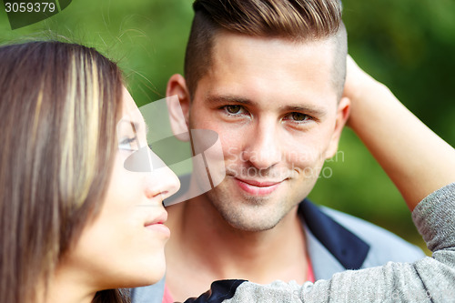 Image of Happy smiling young couple outdoor. valentine concept