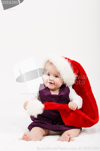 Image of Child girl with Christmas santa hat