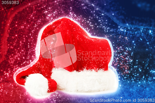 Image of red santa hat on abstract background