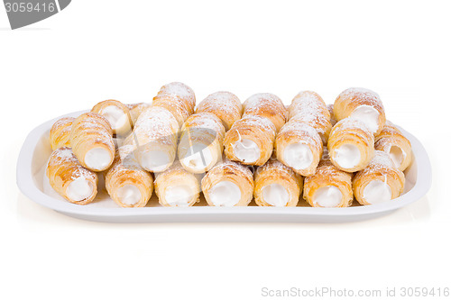 Image of tube of pastry filled with snow