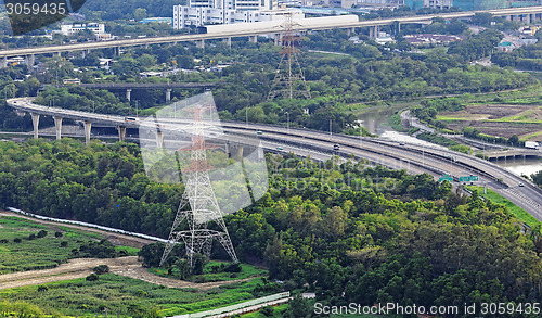 Image of Highway Traffic and transmission tower 