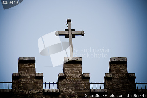 Image of Christian crucifix cross on a rooftop