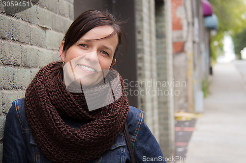 Image of Fashionable woman posing on the street