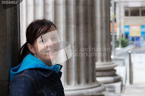 Image of Young woman posing on the street