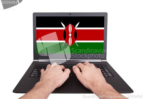 Image of Hands working on laptop, Kenya