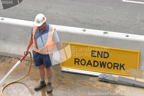 Image of Workman hosing