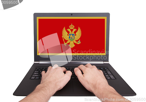 Image of Hands working on laptop, Montenegro