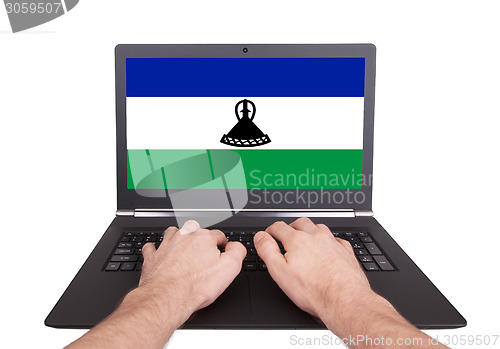 Image of Hands working on laptop, Lesotho