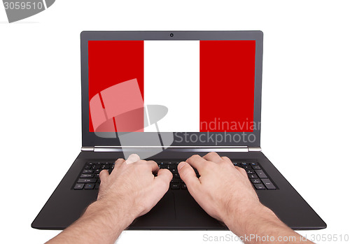 Image of Hands working on laptop, Peru