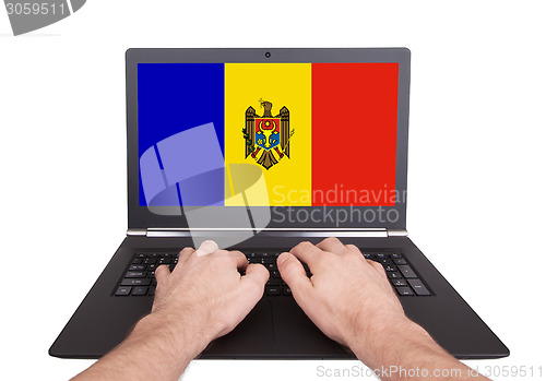Image of Hands working on laptop, Moldova