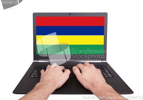 Image of Hands working on laptop, Mauritius