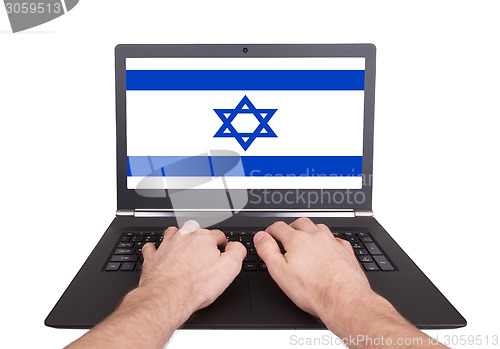 Image of Hands working on laptop, Israel