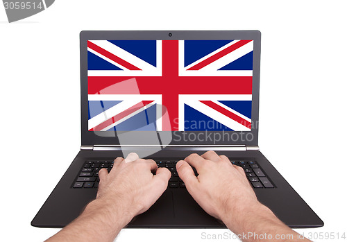 Image of Hands working on laptop, United Kingdom