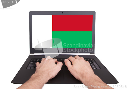 Image of Hands working on laptop, Madagascar