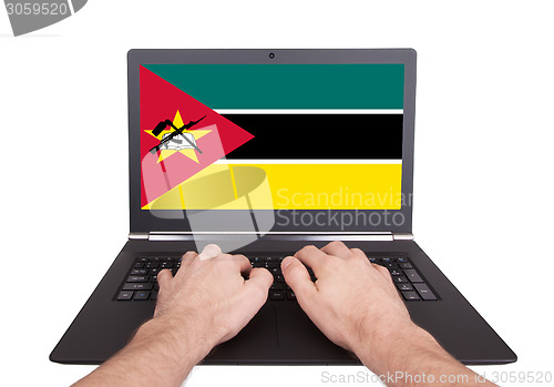 Image of Hands working on laptop, Mozambique