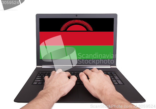 Image of Hands working on laptop, Malawi