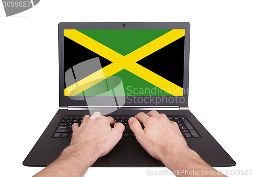 Image of Hands working on laptop, Jamaica