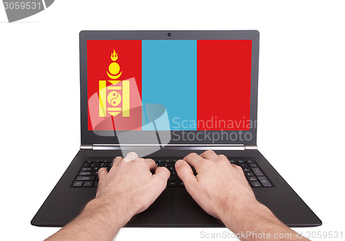 Image of Hands working on laptop, Mongolia
