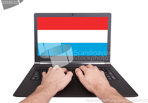 Image of Hands working on laptop, Luxembourg
