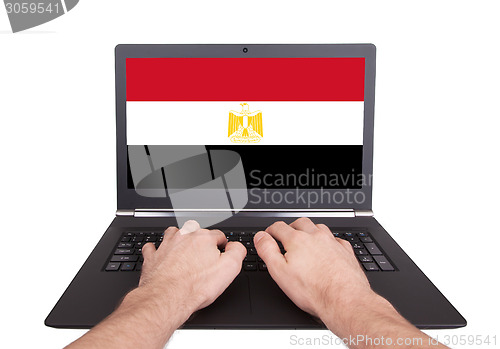 Image of Hands working on laptop, Egypt