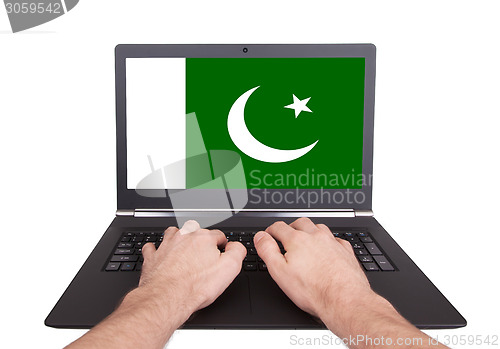 Image of Hands working on laptop, Pakistan