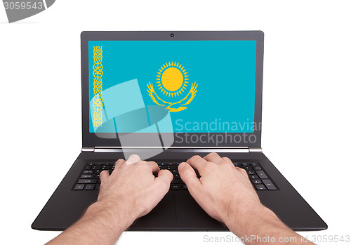 Image of Hands working on laptop, Kazakhstan