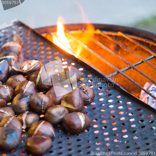 Image of Grilling chestnuts.