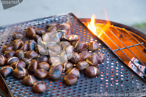 Image of Grilling chestnuts.