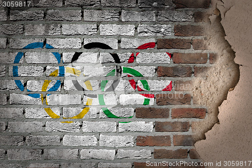 Image of Dark brick wall with plaster - Olympic rings